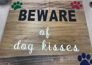 Beware of dog kisses sign